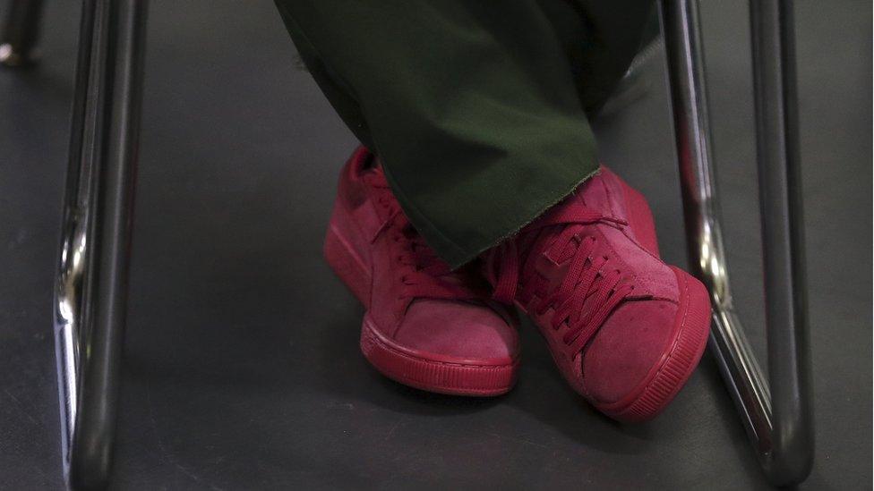 An inmates shoes are pictured during a class at the Taconic Correctional Facility in Bedford Hills, New York (April 8, 2016)