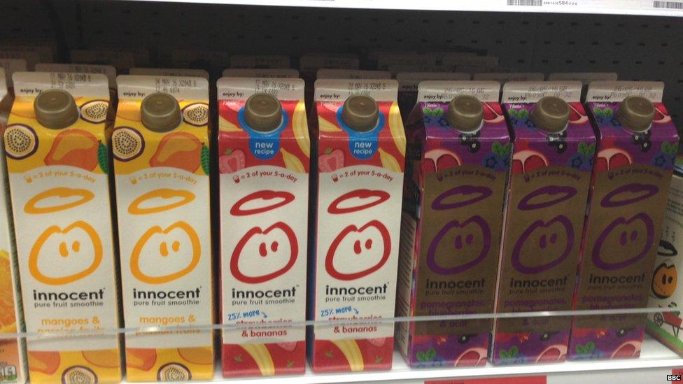 Innocent strawberry and banana smoothie on supermarket shelf.