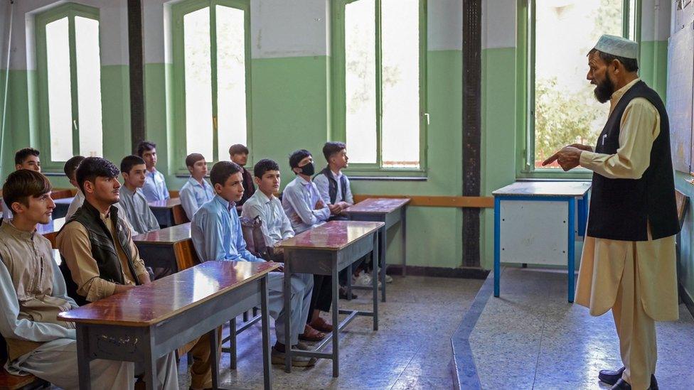 Boys attend their class at Istiklal school in Kabul on September 18, 2021