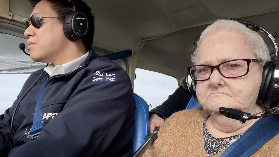 Bernie Drysdale in the plane with the pilot