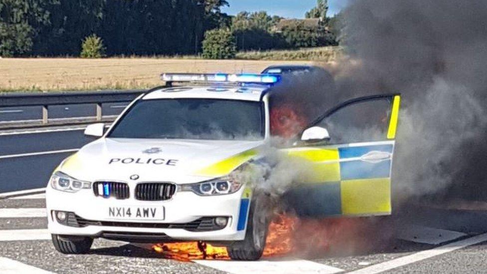 The police car on fire