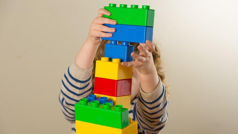 A child with giant Lego