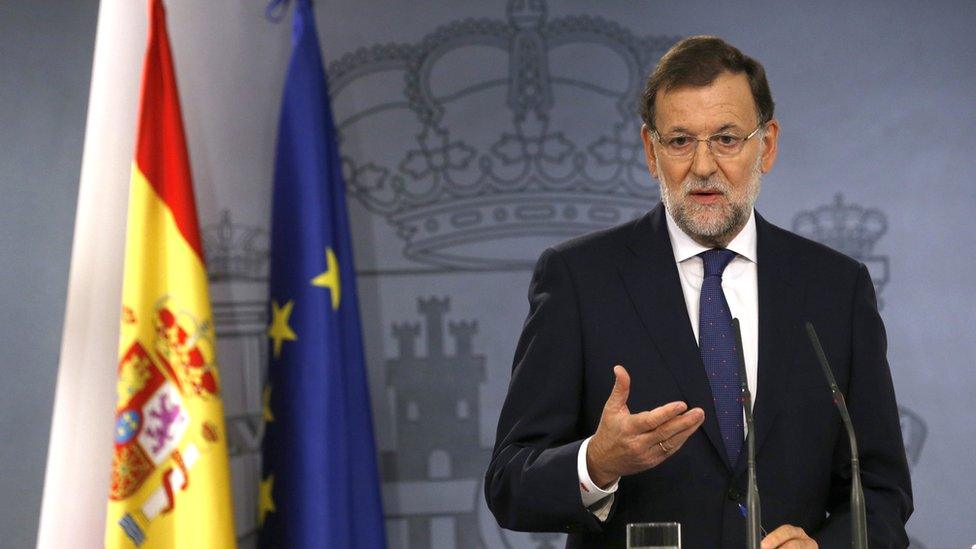 Spanish Prime Minister Mariano Rajoy talks to media during a press conference in Madrid