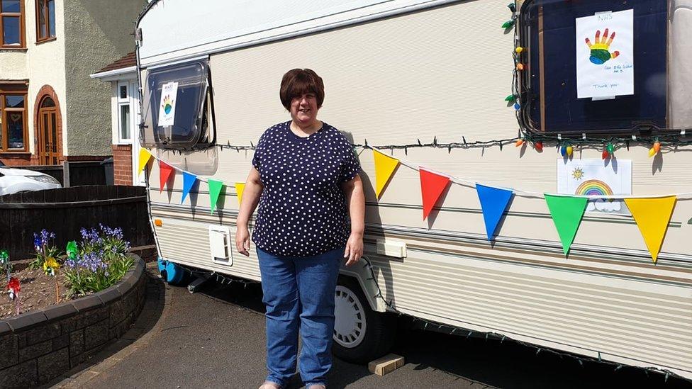 Sarah Link in front of her caravan