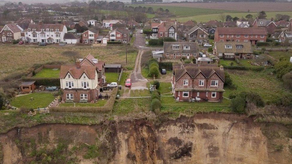 Houses near a collapsing cliff at Mundesley in Norfolk