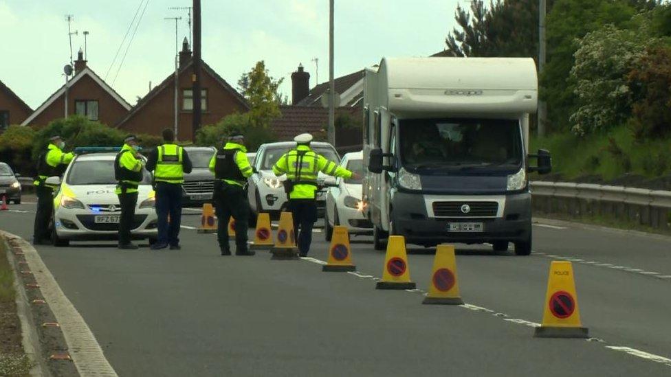 Officers were seen stopping vehicles along the main Belfast to Newry Road