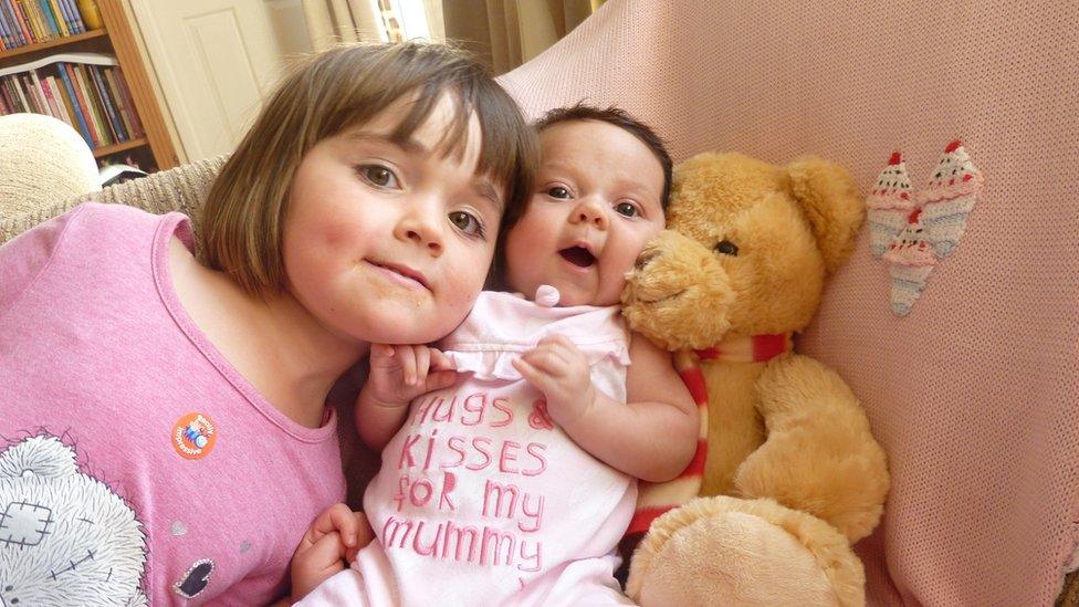 Penny, 3, with her sister Lois in 2013. "Seeing Lois for the first time, she was adorable wrapped up," Penny told her mum five years on