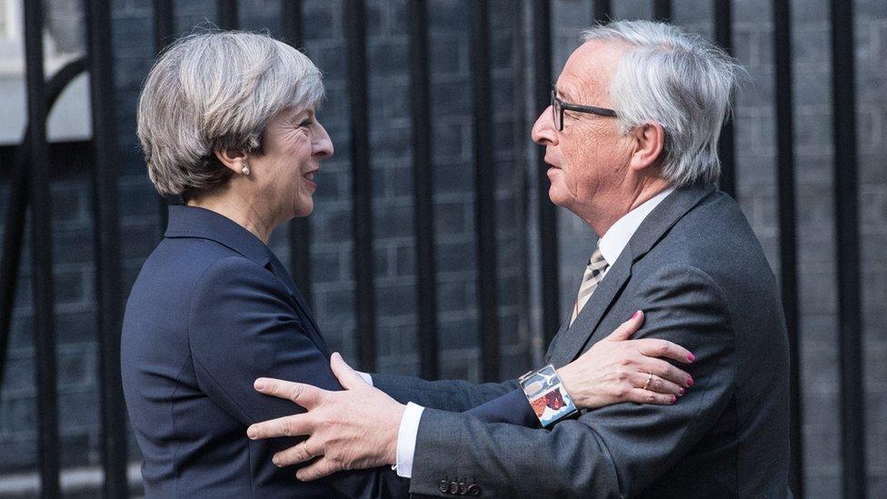 Britain's Prime Minister, Theresa May, greets European Commission president, Jean-Claude Juncker, as he arrives at 10 Downing Street on April 26, 2017