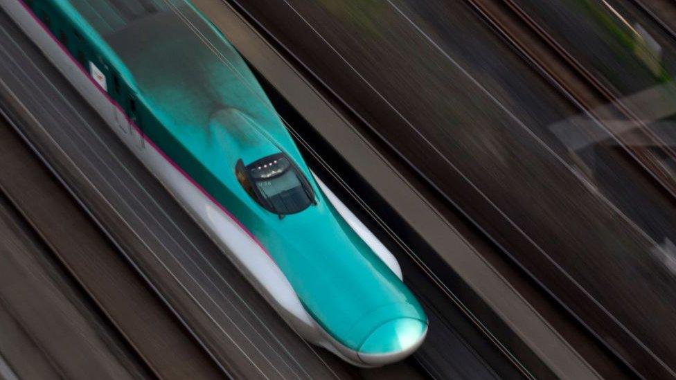 Aerial shot of shinkansen train at speed