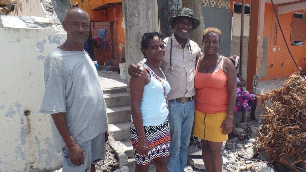 Dr Sam Christian posing with residents of Scott's Head