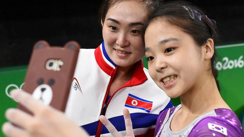 Lee Goim of South Korea takes a selfie with Hong Un Jong of North Korea.