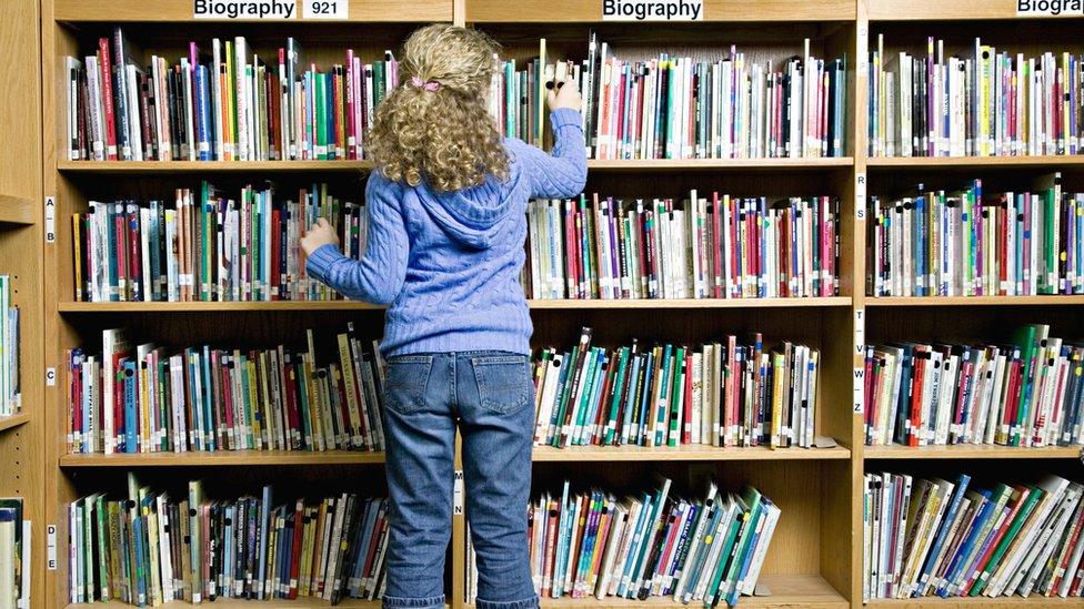 Girl in school library.