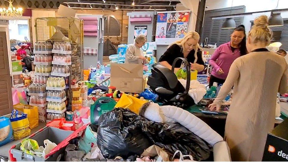 Bags of donated goods piled high