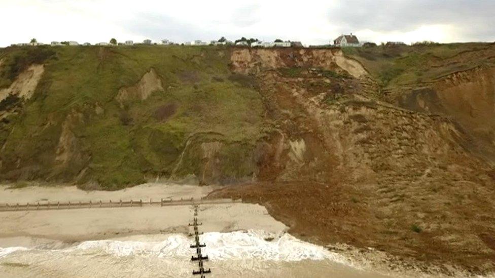 The precarious caravans are pictured close to the cliff's new edge