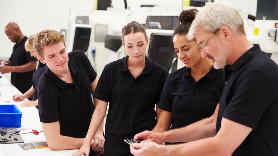 Apprentices in a factory