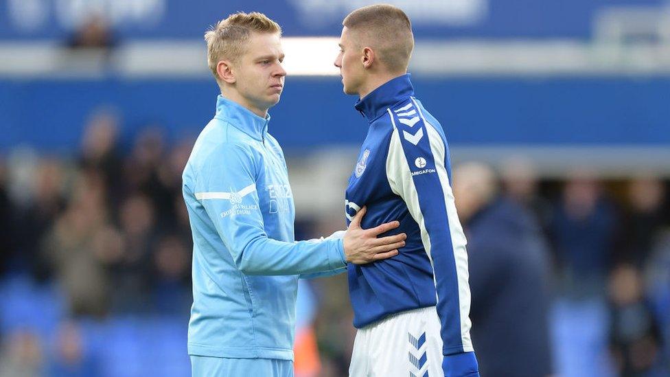 Manchester City's Oleksandr Zinchenko and Everton's Vitalii Mykolenko