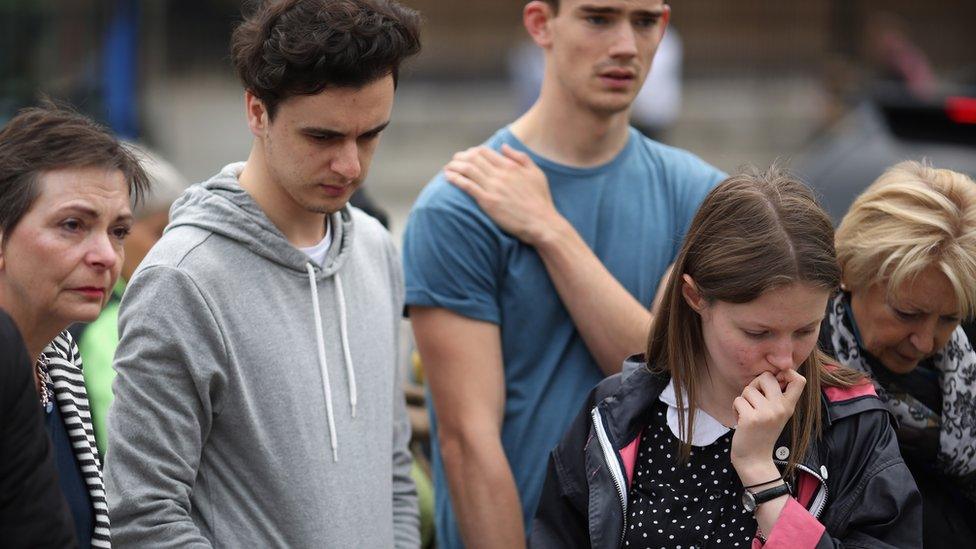 People looking at Jo Cox tributes