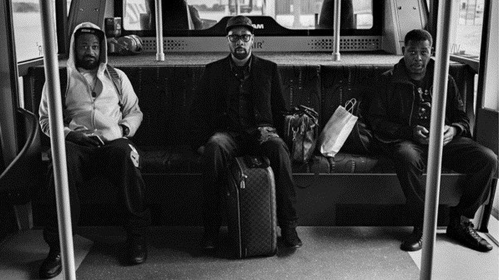 Wu-Tang Clan members in an airport shuttle bus