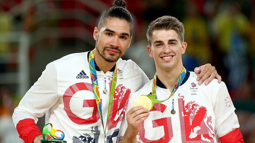 Silver medallist Louis Smith (L) and gold medallist Max Whitlock (R) of Great Britain pose for photographs on the podium at the medal ceremony for Men's Pommel Horse on Day 9 of the Rio 2016 Olympic Games