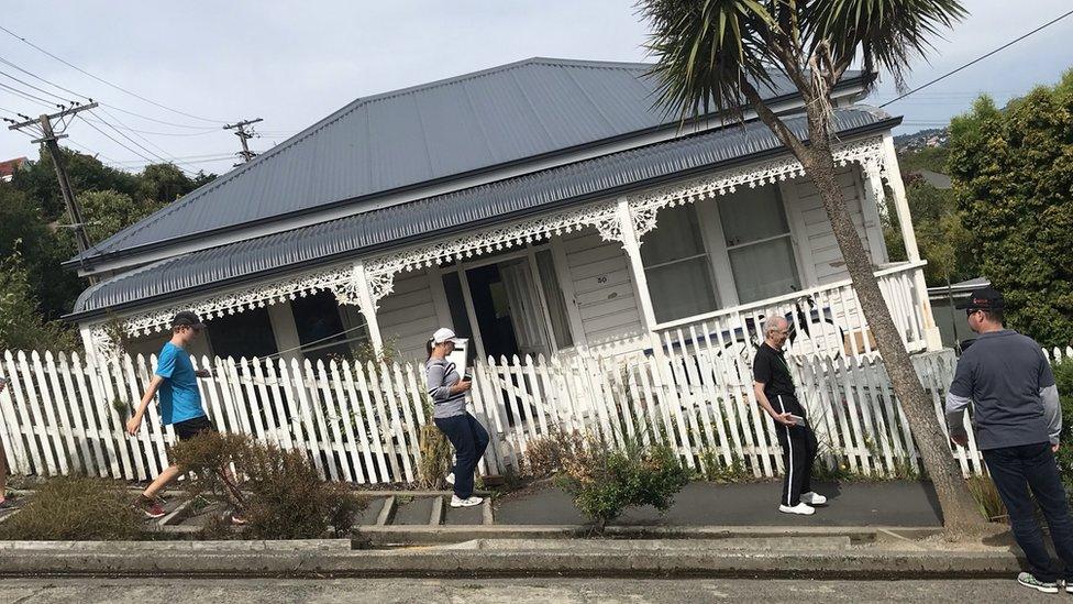 People walking along Baldwin Street, Dunedin