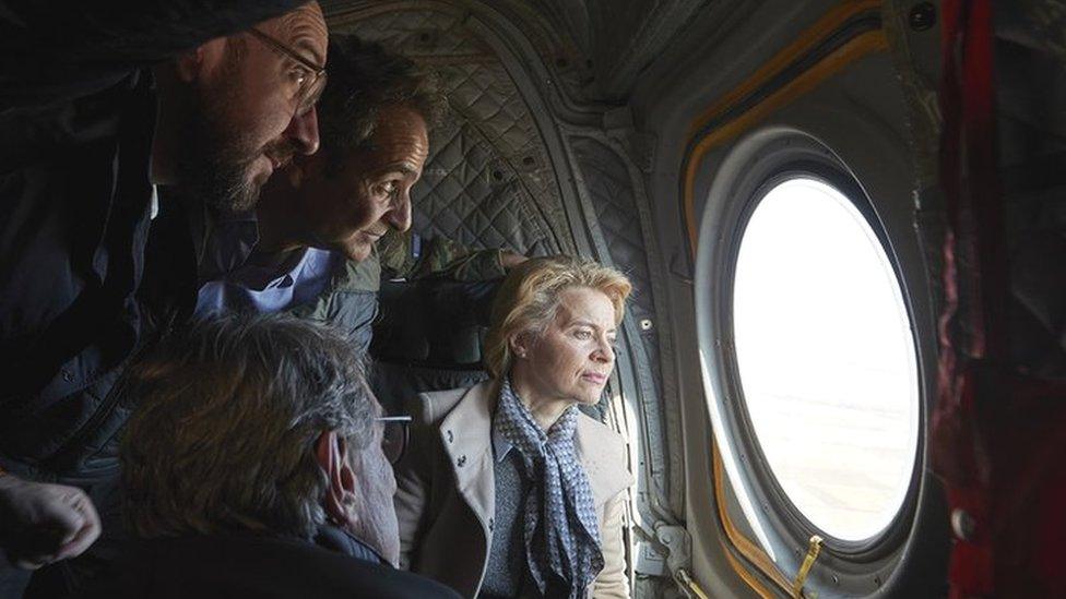 Greek Prime Minister Kyriakos Mitsotakis (2-L) with European Council President Charles Michel (L), European Commission President Ursula von der Leyen (R) and European Parliament President David Sassoli (bottom, back to camera), looking out of the window of a helicopter during a flight over Evros, at the Greek-Turkish border in northern Greece, 03 March 2020