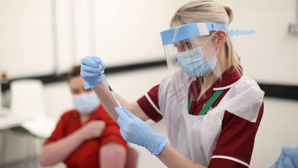 A nurse preparing a Covid-19 vaccine