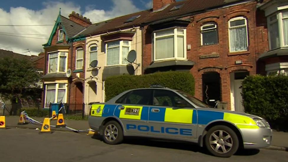 Police car outside property