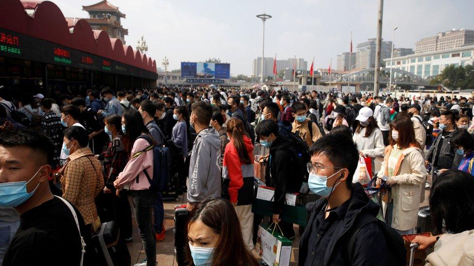 Crowds of people outside Beijing Railway station