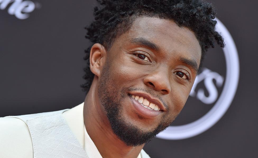 Chadwick Boseman looking at camera