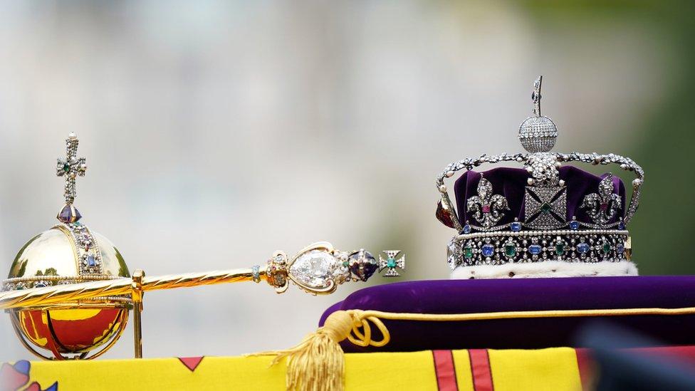 The Imperial State Crown, orb, and sceptre, pictured on top of the late Queen's coffin