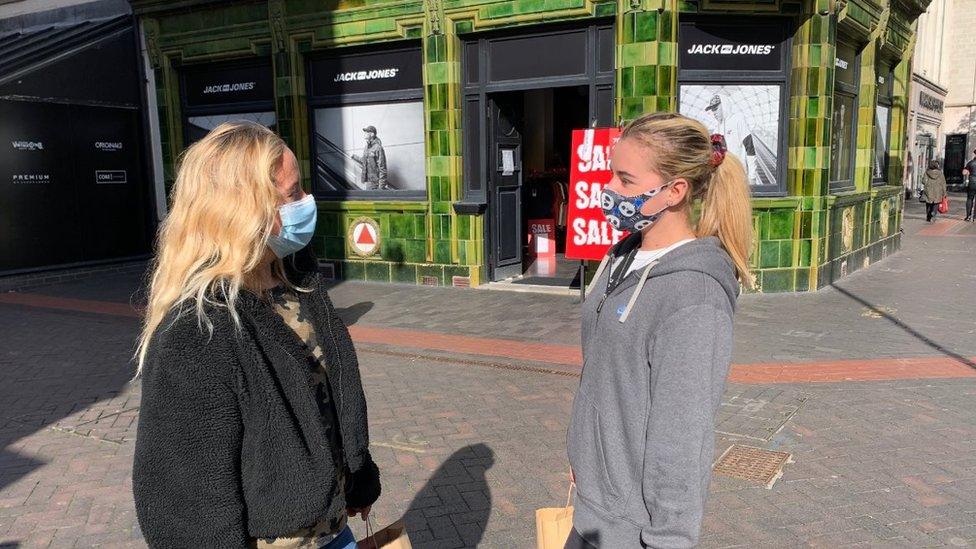 Two women talk while wearing masks in Middlesbrough