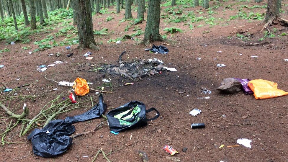 Rubbish and fire damage at an abandoned campsite near Bonaly Reservoir in the Pentlands