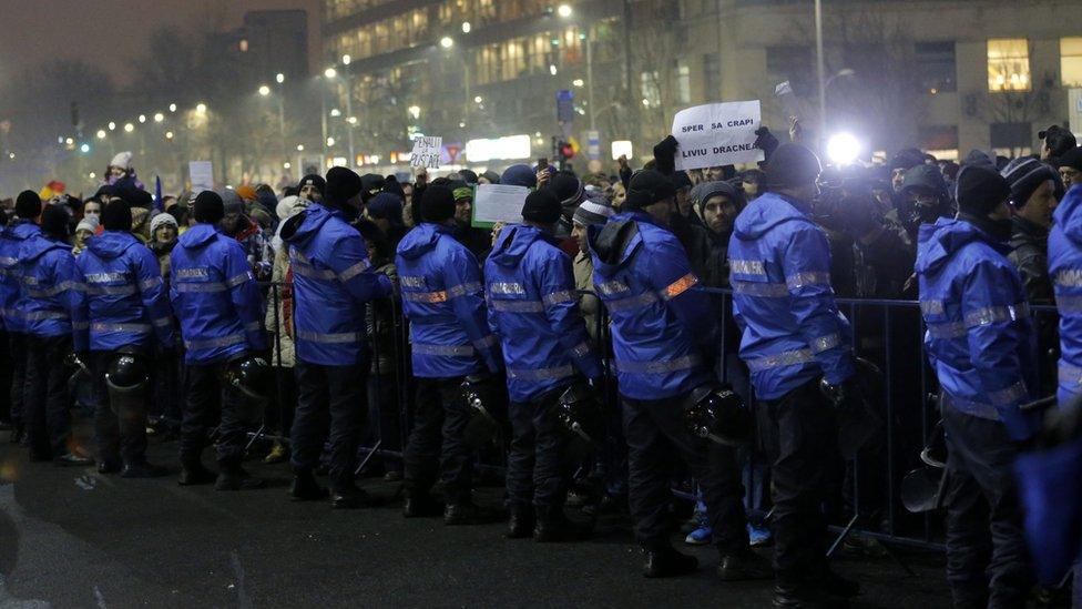 Riot police guard government headquarters during a protest in Bucharest, Romania, 22 January 2017