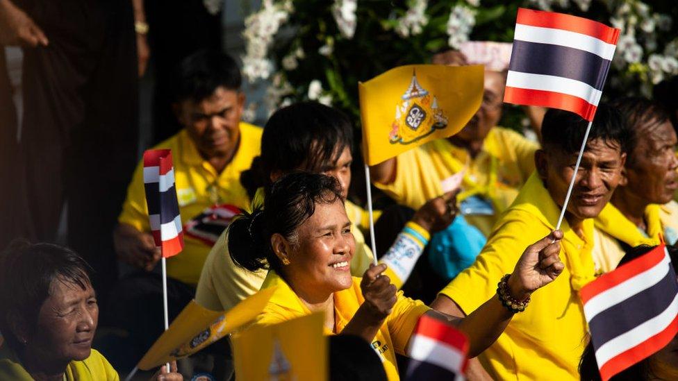 Thai spectators watch the Royal Land Procession for King Maha Vajiralongkorn on May 5