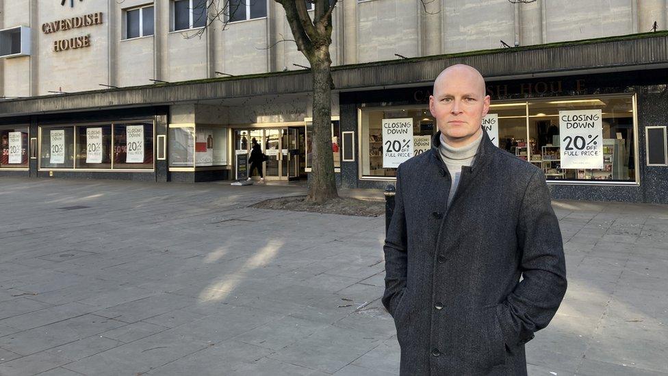 Max Wilkonson standing outside House of Fraser in Cheltenham