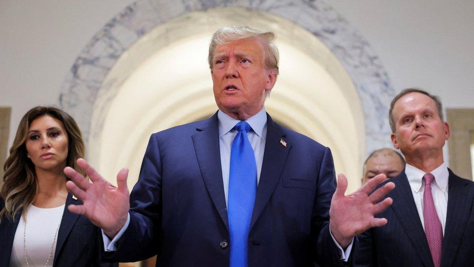 Former President Donald Trump speaks to reporters outside court