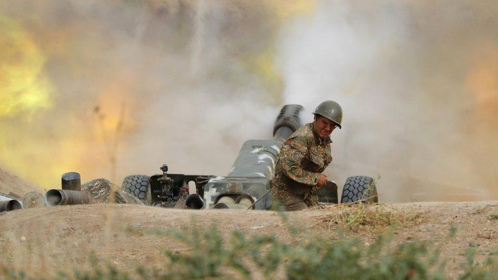 An Armenian soldier is seen amid military clashes with Azeri army along the contact line of the self-proclaimed Nagorno-Karabakh region