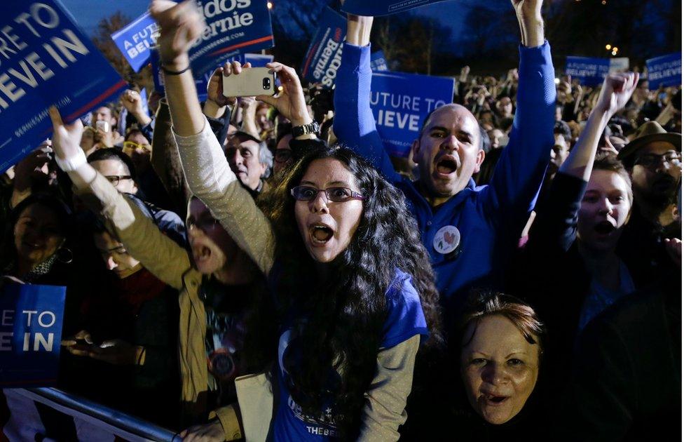 Supporters for Democratic presidential candidate Sen. Bernie Sanders, I-Vt., react as he speaks during a campaign rally