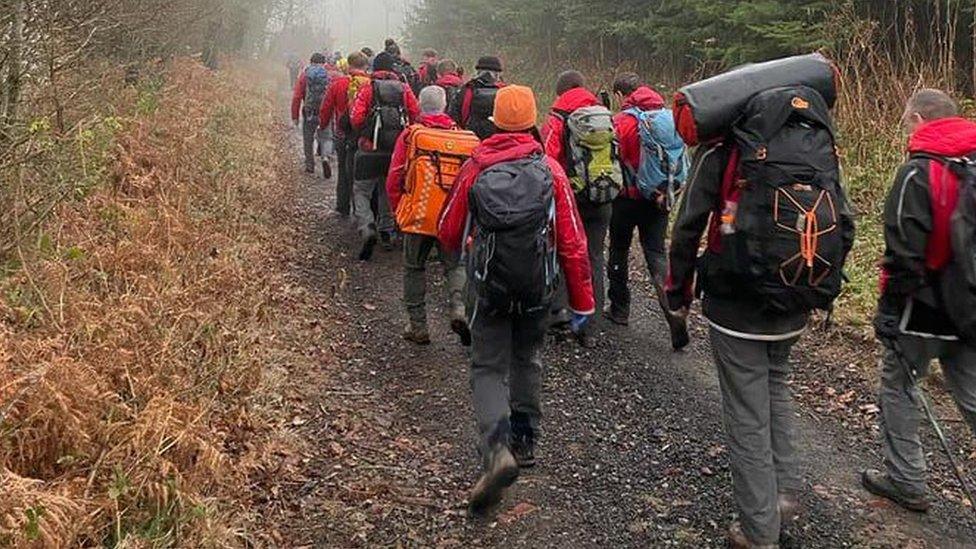 Members of the public and mountain rescuers on a search on Skirrid Fach