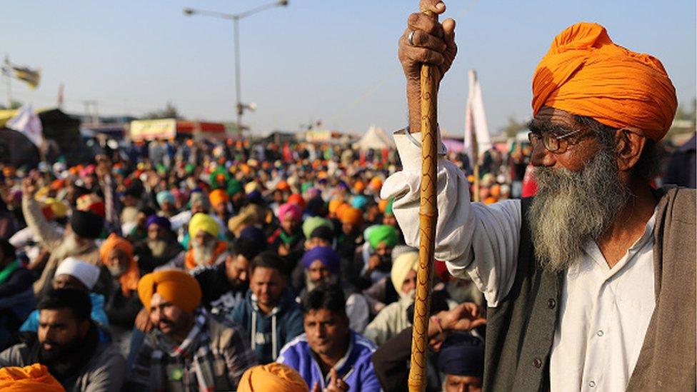 Farmers gather at a protest site during a protest against the newly passed farm bills at the Delhi- Haryana border in Tikri, New Delhi, India, on December 14, 2020. (Photo by Amarjeet Kumar Singh/Anadolu Agency via Getty Images)