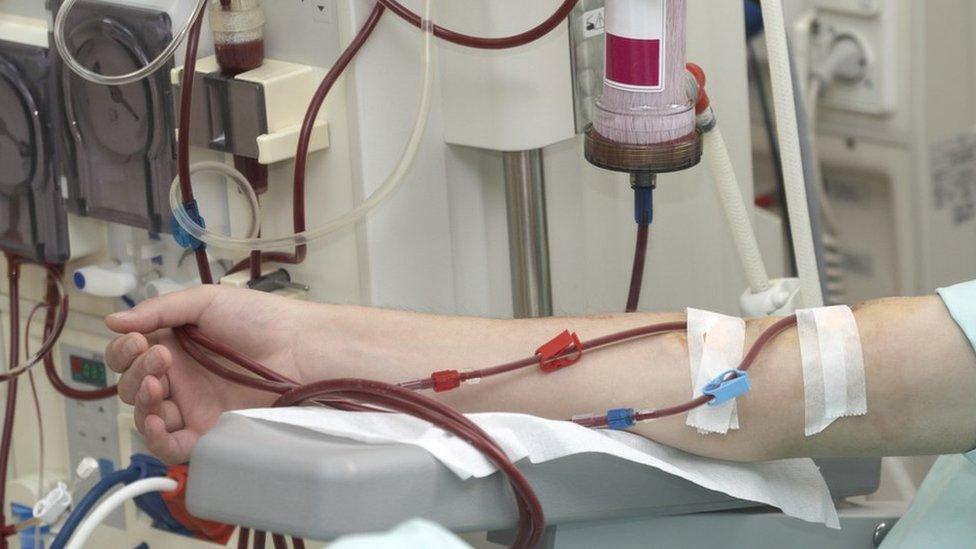 A person receiving dialysis