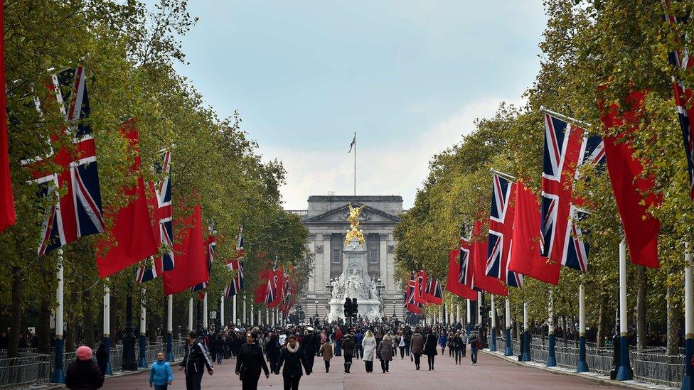 British Union flags and Chinese flags fly together on the Mall in central London