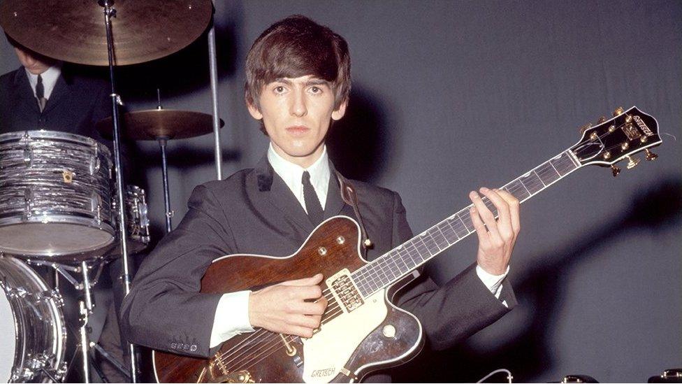 George Harrison with guitar