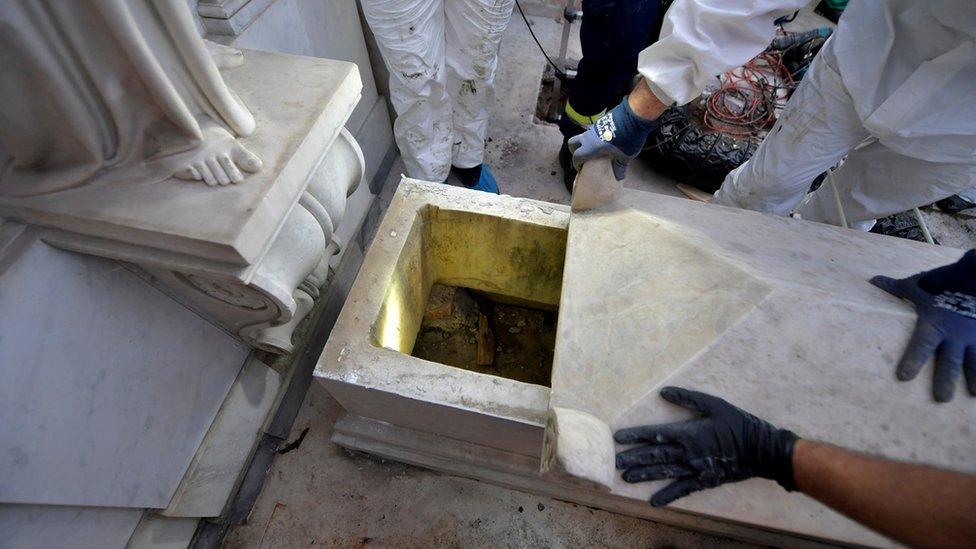 A tomb is opened in a cemetery on the Vatican's grounds, 11 July 2019