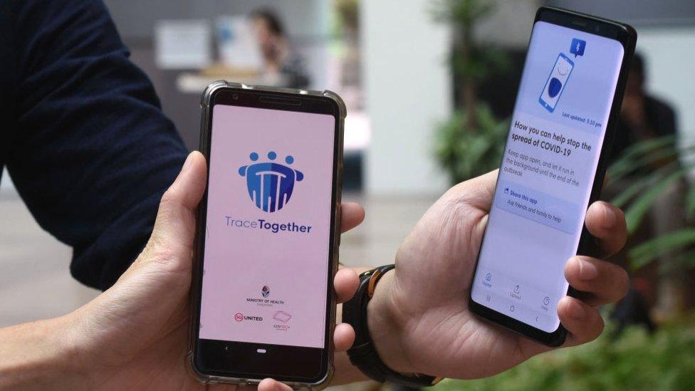 The chief of Singapore's TraceTogether app says human checkers are still required