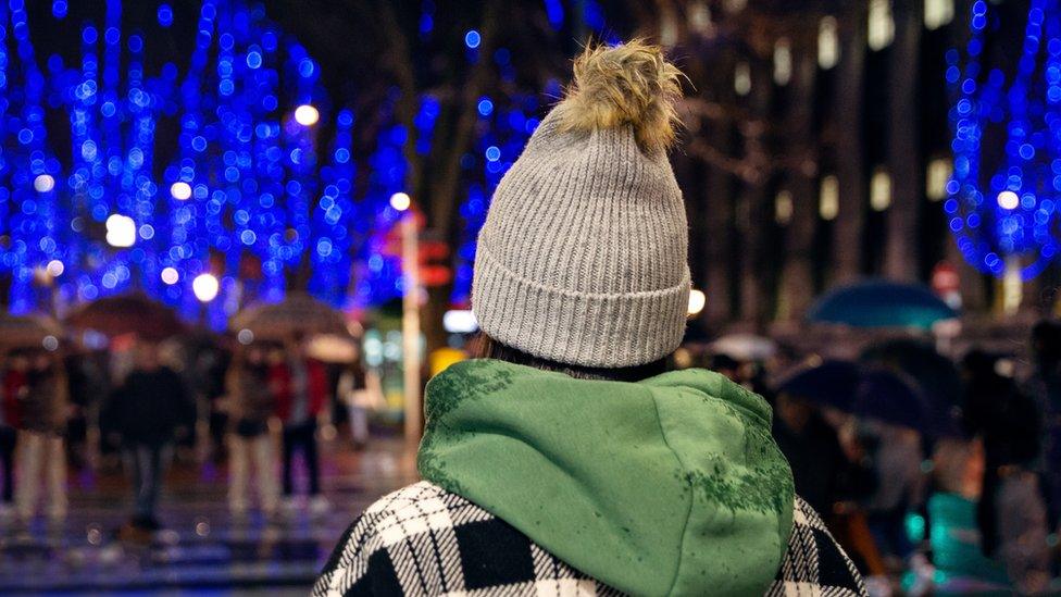 Young person in hat from behind