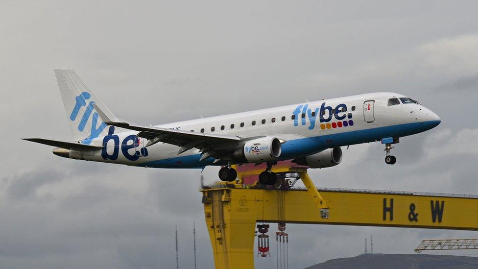 A plane lands at Belfast City Airport