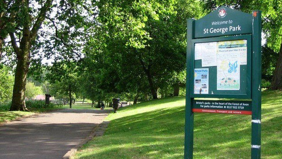 St Georges park entrance with a sign on the right and a pathway on the left