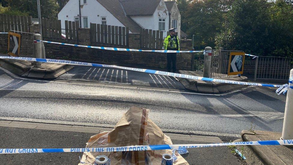 A police cordon remains in place on Woodhouse Hill