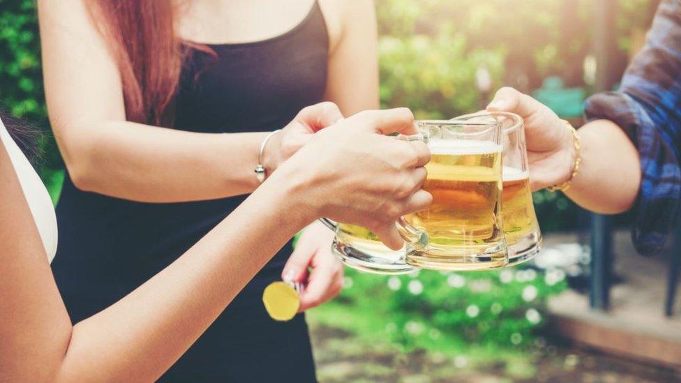 Young people drinking beer